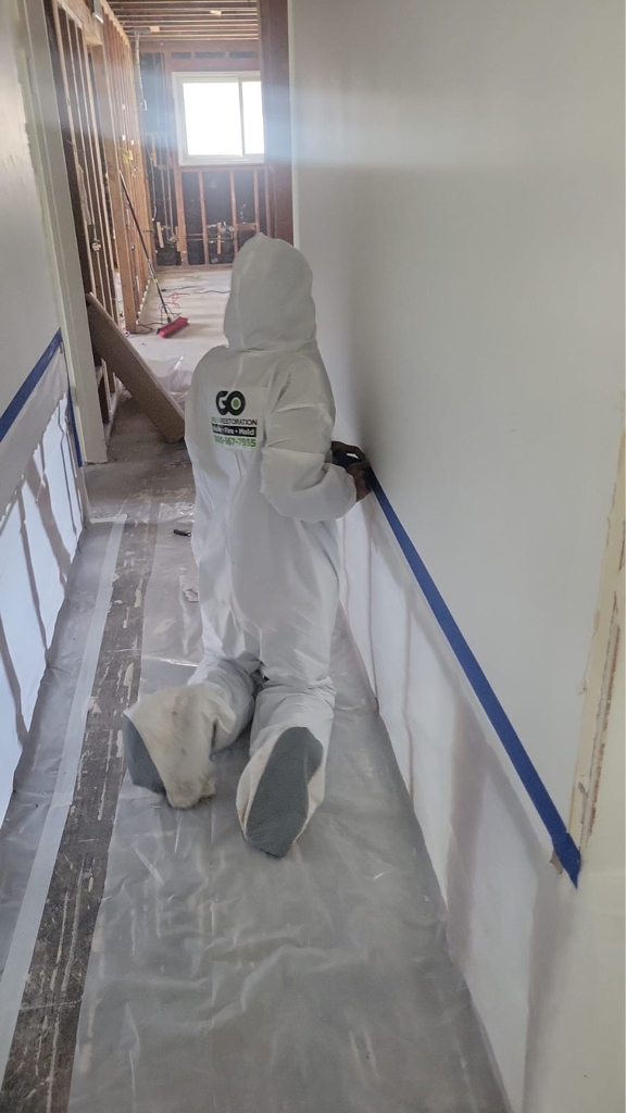 Go Green technician performing water damage repair